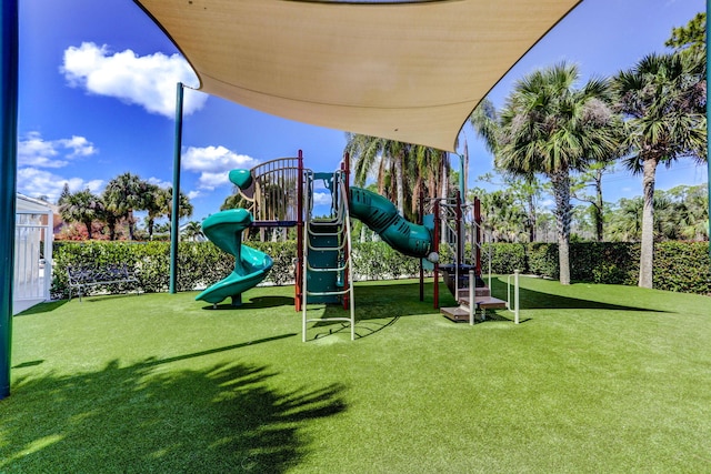 view of jungle gym featuring a lawn