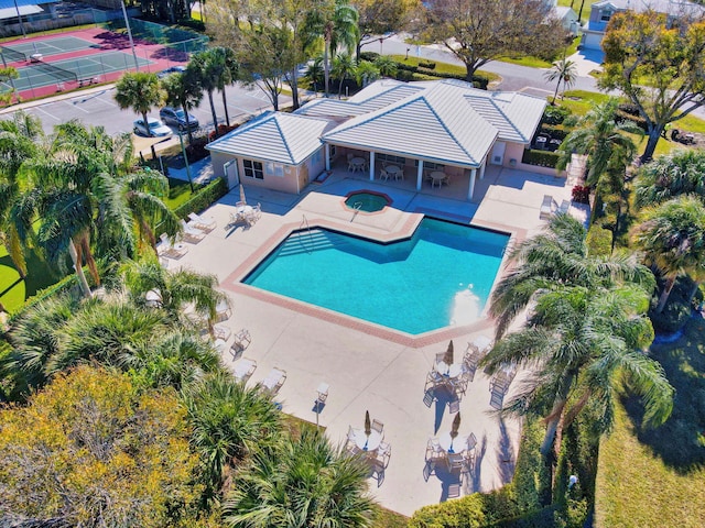 view of pool with a patio area and a community hot tub