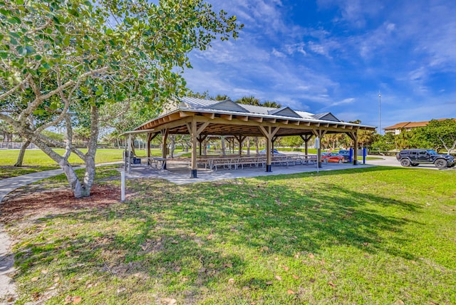 surrounding community featuring a gazebo and a lawn