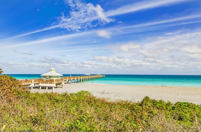 property view of water featuring a gazebo and a beach view