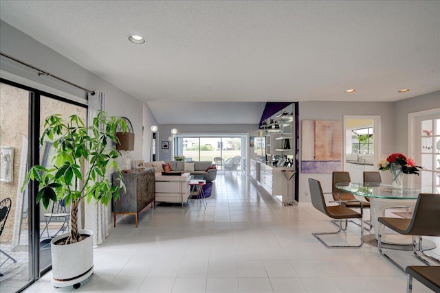 interior space featuring a textured ceiling and recessed lighting