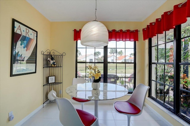 tiled dining space with baseboards