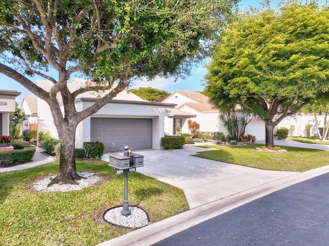 view of front of home featuring a garage, stucco siding, concrete driveway, and a front yard