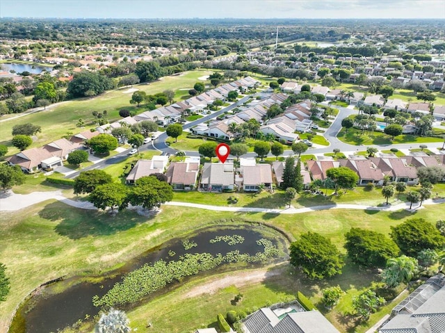 aerial view featuring a water view, view of golf course, and a residential view