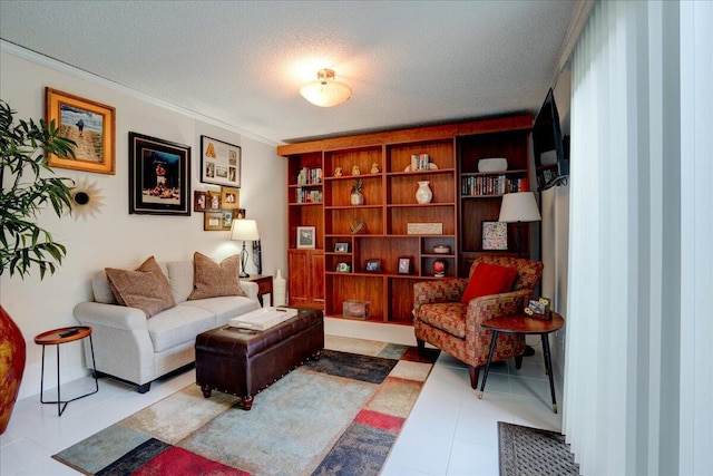 living area featuring light tile patterned floors, ornamental molding, and a textured ceiling