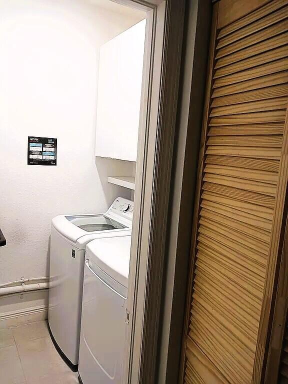 clothes washing area featuring washing machine and clothes dryer