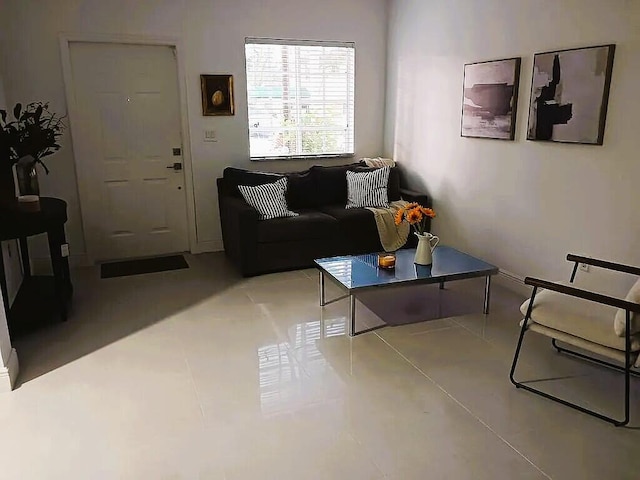 living room featuring light tile patterned flooring