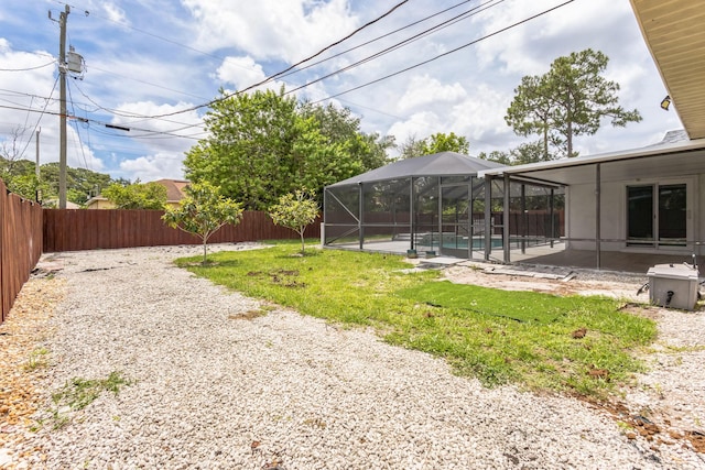 view of yard featuring a lanai and a patio