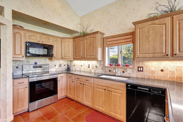 kitchen with light brown cabinetry, sink, black appliances, and tile patterned flooring