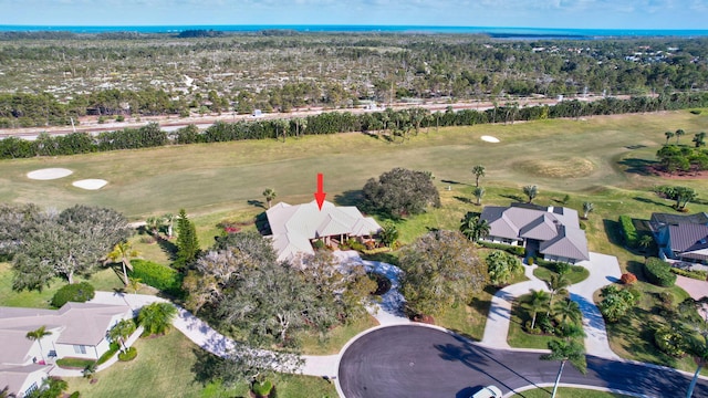 birds eye view of property with golf course view