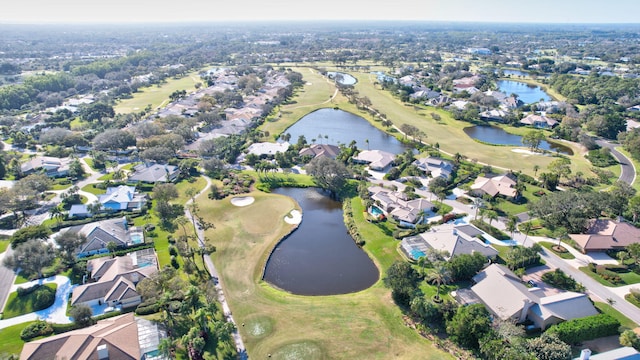 birds eye view of property with a residential view, view of golf course, and a water view