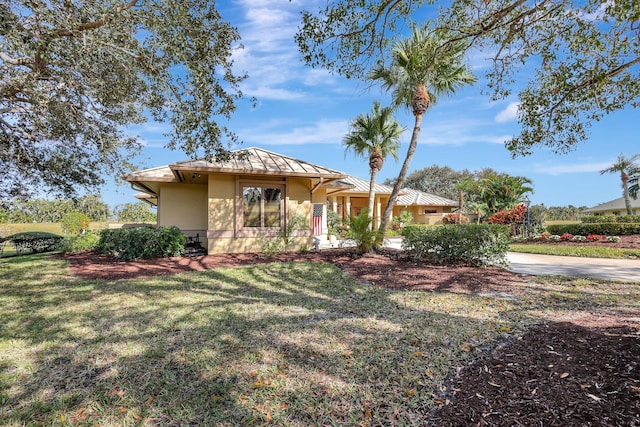 single story home with stucco siding and a front yard