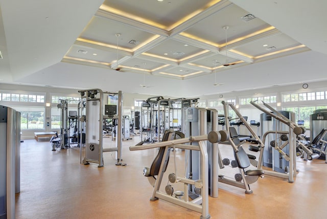 exercise room featuring a high ceiling and coffered ceiling