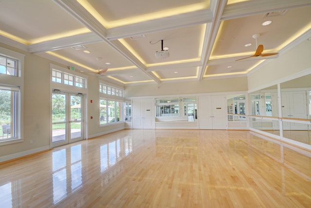 interior space with ceiling fan, beamed ceiling, and coffered ceiling