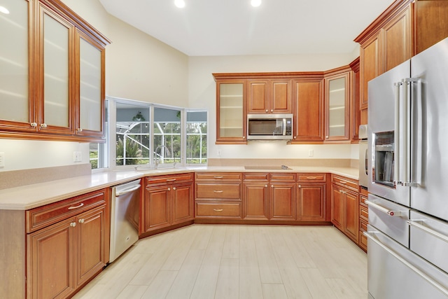 kitchen featuring sink, stainless steel appliances, and light hardwood / wood-style flooring