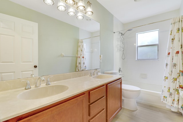 full bathroom with toilet, vanity, and shower / tub combo with curtain