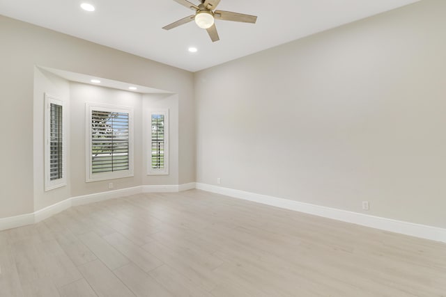 unfurnished room with ceiling fan and light hardwood / wood-style flooring