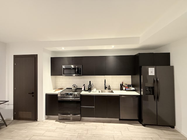 398 NE 5th St Unit 1715, Miami, FL 33132 - kitchen with appliances with stainless steel finishes, tasteful backsplash, and sink