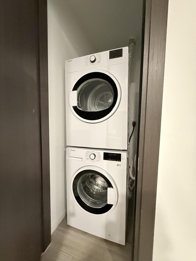 398 NE 5th St Unit 1715, Miami, FL 33132 - laundry area with light hardwood / wood-style floors and stacked washer / drying machine