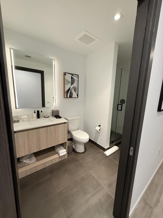 398 NE 5th St Unit 1715, Miami, FL 33132 - bathroom with vanity, toilet, and a shower with shower door