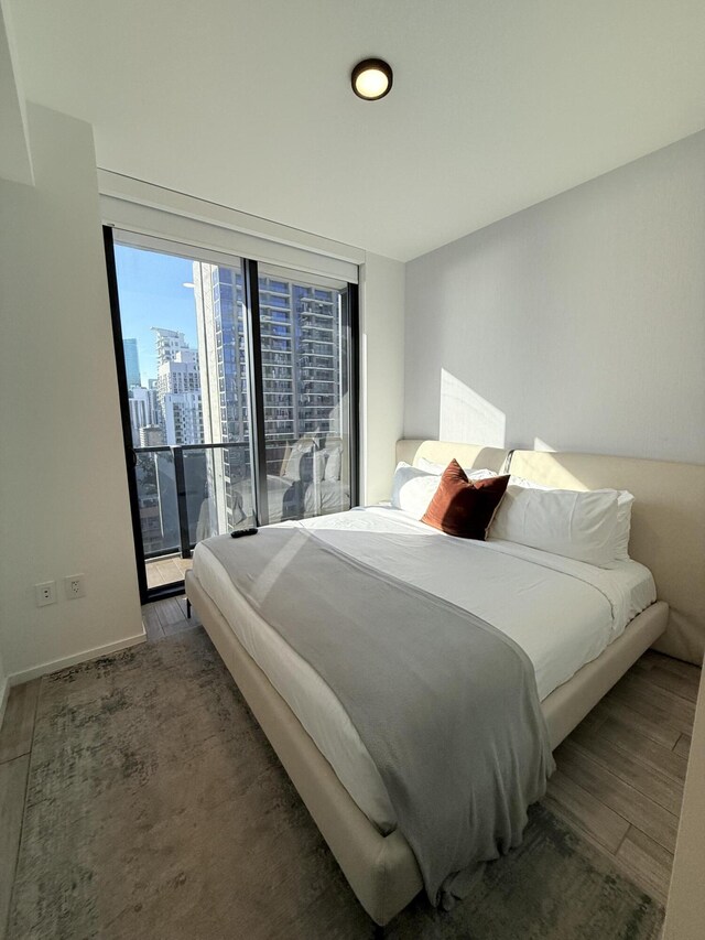 398 NE 5th St Unit 1715, Miami, FL 33132 - bedroom featuring access to outside and dark wood-type flooring