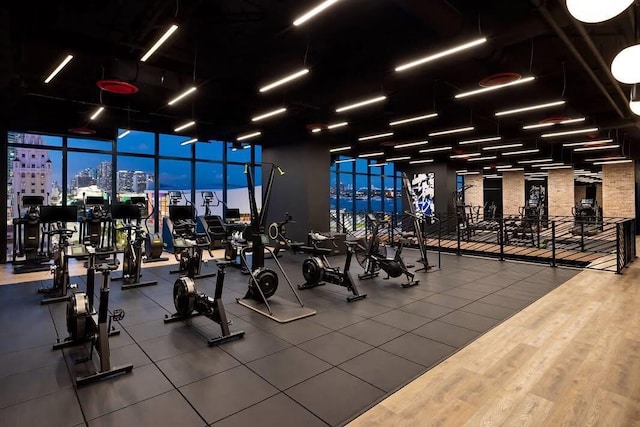 398 NE 5th St Unit 1715, Miami, FL 33132 - exercise room featuring a wall of windows and hardwood / wood-style flooring