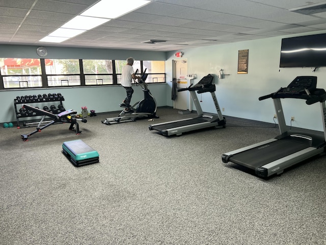 gym featuring a paneled ceiling