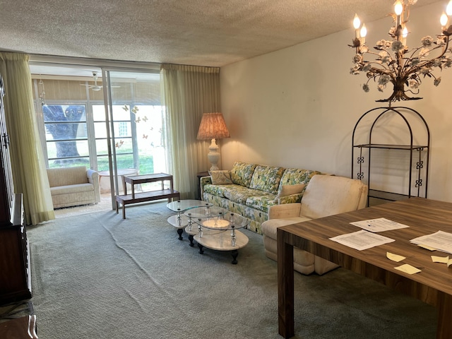 living room with carpet floors, a textured ceiling, and a chandelier