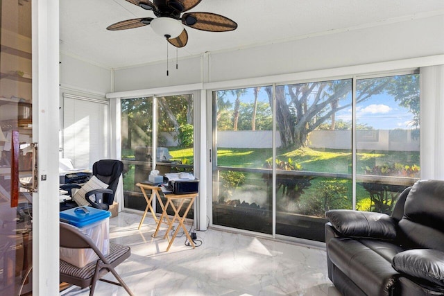 sunroom featuring ceiling fan