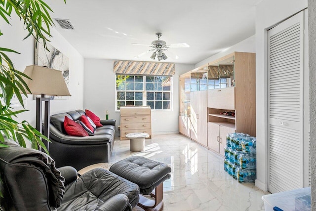 sitting room with ceiling fan