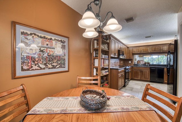 dining room featuring a textured ceiling