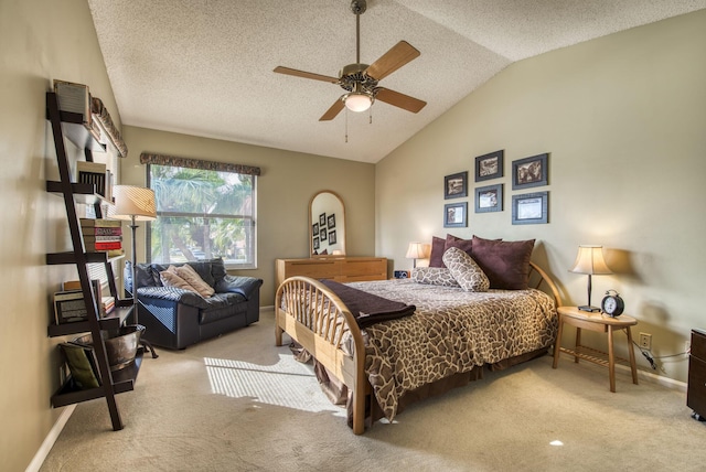 bedroom featuring a textured ceiling, ceiling fan, lofted ceiling, and light carpet