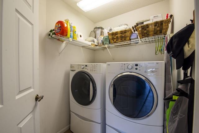 laundry room featuring washer and clothes dryer