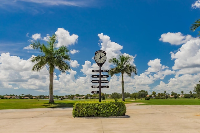 view of property's community with a yard