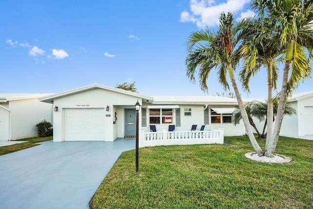 single story home with a garage and a front lawn