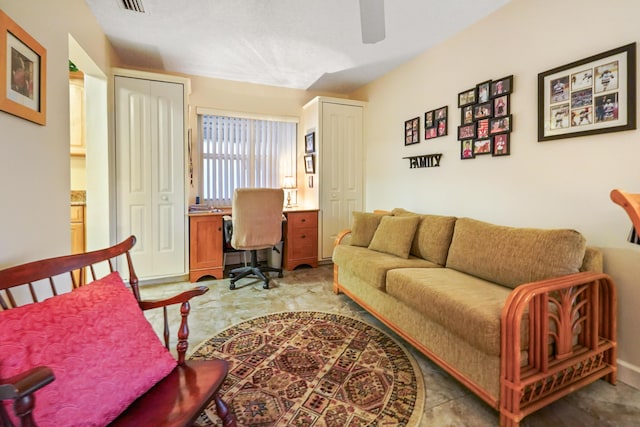 interior space featuring visible vents and a ceiling fan