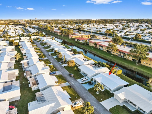 bird's eye view with a residential view and a water view