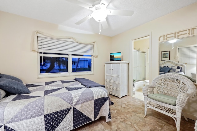 bedroom featuring connected bathroom, a ceiling fan, light tile patterned flooring, and a textured ceiling