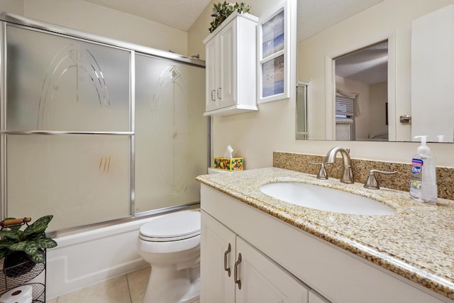 full bath with tile patterned flooring, toilet, vanity, enclosed tub / shower combo, and a textured ceiling