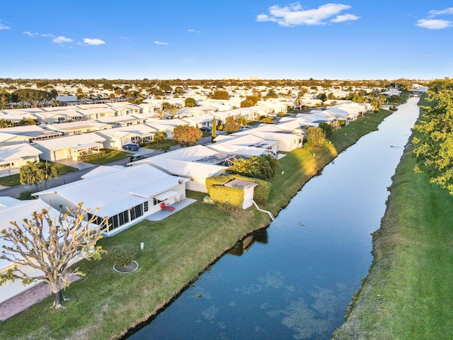 birds eye view of property with a residential view and a water view