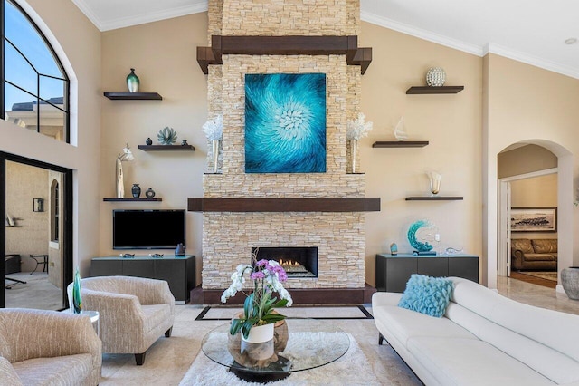 living room with a fireplace, lofted ceiling, and ornamental molding