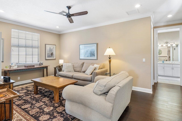 living room featuring ceiling fan, dark hardwood / wood-style flooring, ornamental molding, and a textured ceiling