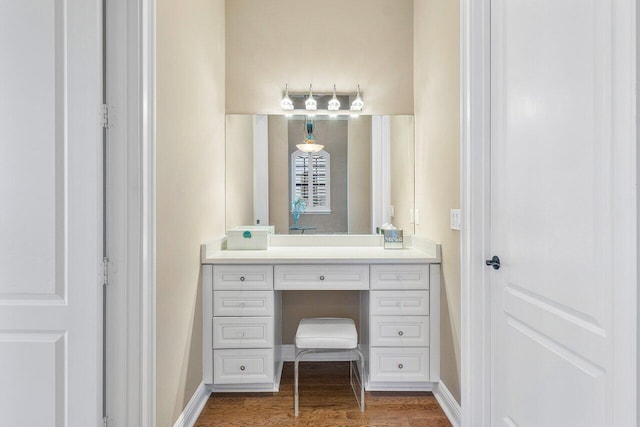 bathroom featuring vanity and hardwood / wood-style flooring