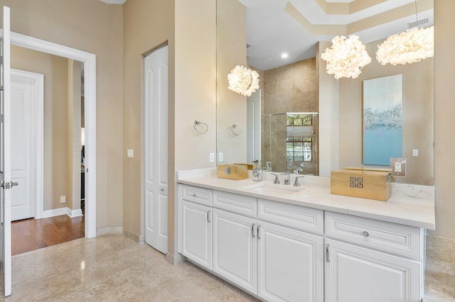 bathroom featuring vanity and an inviting chandelier