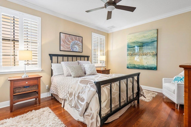 bedroom with ceiling fan, dark hardwood / wood-style flooring, ornamental molding, and multiple windows