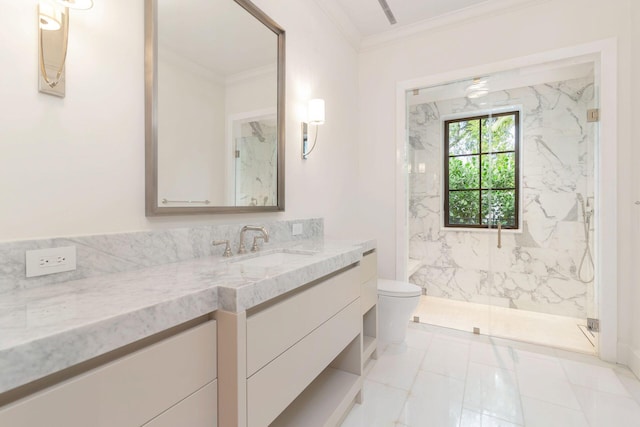 bathroom featuring toilet, vanity, a shower with shower door, and crown molding