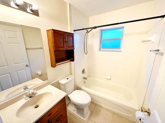 full bathroom featuring tiled shower / bath combo, vanity, a textured ceiling, tile patterned floors, and toilet