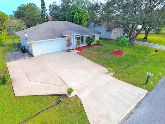 ranch-style home with a front yard and a garage