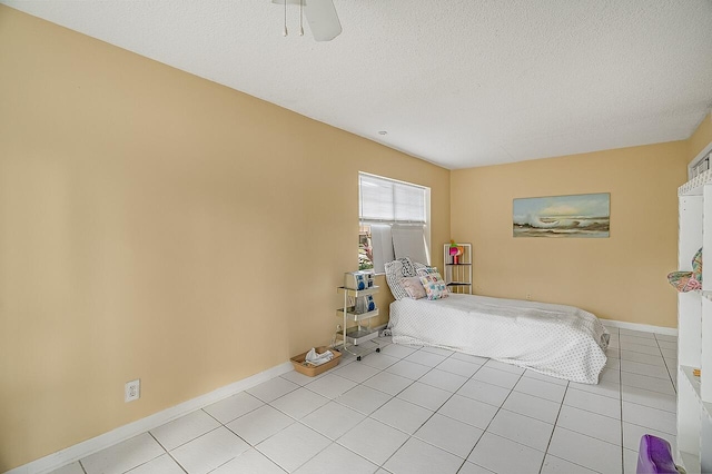 unfurnished bedroom featuring a textured ceiling and light tile patterned floors