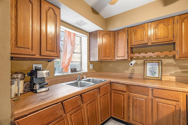 kitchen featuring sink and ceiling fan